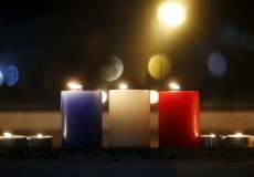 Candles in blue, white and red, the colors of the French flag, are placed in tribute to the victims of Paris attacks in front of the French embassy in Seoul